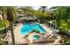 Community pool and spa with lounge chairs and patio area at 21320 N 56Th St # 2001, Phoenix, AZ 85054