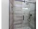 Walk-in shower with pebble floor and modern fixtures at 21320 N 56Th St # 2001, Phoenix, AZ 85054