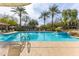 Inviting community swimming pool with surrounding lounge chairs at 21320 N 56Th St # 2001, Phoenix, AZ 85054