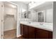 Double vanity bathroom with dark brown cabinets and white countertop at 2150 W Alameda Rd # 1112, Phoenix, AZ 85085