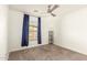 Well lit bedroom featuring carpet, ceiling fan and blue curtains at 2150 W Alameda Rd # 1112, Phoenix, AZ 85085