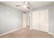 Bedroom with double door closet and ceiling fan at 2150 W Alameda Rd # 1112, Phoenix, AZ 85085