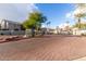 Community entrance with brick pavers and landscaping at 2150 W Alameda Rd # 1112, Phoenix, AZ 85085