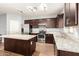 Spacious kitchen featuring granite countertops and stainless steel appliances at 2150 W Alameda Rd # 1112, Phoenix, AZ 85085