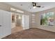 Cozy carpeted bedroom with large windows and ceiling fan at 21893 N 78Th St, Scottsdale, AZ 85255