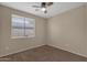 Simple bedroom with carpet, window blinds, and ceiling fan at 21893 N 78Th St, Scottsdale, AZ 85255