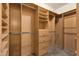 Large walk-in closet with ample shelving and rods at 21893 N 78Th St, Scottsdale, AZ 85255