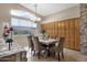 Elegant dining room with wood cabinets, chandelier, and large windows at 21893 N 78Th St, Scottsdale, AZ 85255