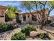 Landscaped front yard with a brick pathway leading to the home's entrance at 21893 N 78Th St, Scottsdale, AZ 85255