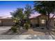 Tan stucco house with desert landscaping and two-car garage at 21893 N 78Th St, Scottsdale, AZ 85255