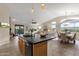 Open kitchen with island, stainless steel appliances, and views to dining area at 21893 N 78Th St, Scottsdale, AZ 85255