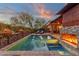 Luxury pool area with fire pit and lounge chairs at sunset at 21893 N 78Th St, Scottsdale, AZ 85255