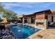 Stunning pool with fountains and a stone fire pit at 21893 N 78Th St, Scottsdale, AZ 85255