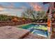 Stunning pool and spa with fire features and beautiful sunset view at 21893 N 78Th St, Scottsdale, AZ 85255