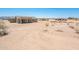 Aerial view of a home with desert landscaping and surrounding properties at 21916 W Duane Ln, Wittmann, AZ 85361