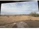 Expansive backyard with open views from a covered patio at 21916 W Duane Ln, Wittmann, AZ 85361