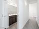 Bright bathroom featuring a double vanity, modern fixtures, and tiled floors at 21916 W Duane Ln, Wittmann, AZ 85361