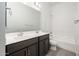 Bathroom features a double sink vanity, white tile, and a shower-tub combination at 21916 W Duane Ln, Wittmann, AZ 85361