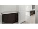Butler's pantry featuring cabinetry and countertop adjacent to a kitchen at 21916 W Duane Ln, Wittmann, AZ 85361