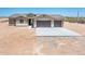 Single-story home featuring a two-car garage, desert landscaping, and neutral color palette at 21916 W Duane Ln, Wittmann, AZ 85361