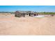 Desert home with desert landscaping, two-car garage, neutral color palette and tile roof at 21916 W Duane Ln, Wittmann, AZ 85361