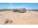 Back of home featuring a covered patio and desert landscaping at 21916 W Duane Ln, Wittmann, AZ 85361