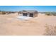 Desert home featuring desert landscaping, a two-car garage, and a tile roof at 21916 W Duane Ln, Wittmann, AZ 85361
