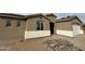 A single Gathering home with an unfinished front yard and a two car garage on a cloudy day at 21916 W Duane Ln, Wittmann, AZ 85361