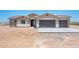 Charming single-story home with a two-car garage, desert landscaping and neutral color palette at 21916 W Duane Ln, Wittmann, AZ 85361