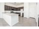 Kitchen with granite countertops, dark wood cabinetry, and stainless steel appliances at 21916 W Duane Ln, Wittmann, AZ 85361