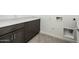 Laundry room with sleek, dark wood cabinetry and ample countertop space at 21916 W Duane Ln, Wittmann, AZ 85361