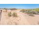 Expansive desert landscape, highlighting the natural beauty of the surroundings and the home at 21916 W Duane Ln, Wittmann, AZ 85361