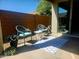 Covered patio with comfortable seating area and an outdoor rug at 2441 W Beverly Rd, Phoenix, AZ 85041