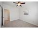 Bedroom with ceiling fan and window, neutral decor at 2441 W Beverly Rd, Phoenix, AZ 85041