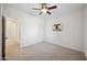 Bright bedroom with ceiling fan and plush carpeting at 2441 W Beverly Rd, Phoenix, AZ 85041