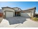 Two-car garage and inviting front porch characterize this beautiful home's exterior at 2441 W Beverly Rd, Phoenix, AZ 85041