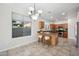 Kitchen with light wood cabinets, granite counters, and island with seating at 2441 W Beverly Rd, Phoenix, AZ 85041