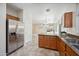 Kitchen with island, stainless steel appliances, and granite countertops at 2441 W Beverly Rd, Phoenix, AZ 85041