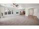 Spacious living room with tile and carpet flooring, and views into the kitchen at 2441 W Beverly Rd, Phoenix, AZ 85041