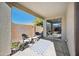 Relaxing covered patio with seating area and rug at 2441 W Beverly Rd, Phoenix, AZ 85041