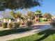 Community playground featuring green turf, a walking path, mature trees, and a covered picnic area at 2441 W Beverly Rd, Phoenix, AZ 85041