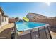 Inviting above ground pool in backyard with fountain at 2441 W Beverly Rd, Phoenix, AZ 85041