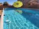 Refreshing above ground pool with a yellow umbrella at 2441 W Beverly Rd, Phoenix, AZ 85041