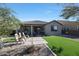 Artificial turf backyard with patio and seating area at 24454 N 173Rd Ln, Surprise, AZ 85387