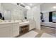 Bathroom with double vanity and walk-in shower at 24454 N 173Rd Ln, Surprise, AZ 85387