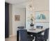 Dining room with marble table and modern chandelier at 24454 N 173Rd Ln, Surprise, AZ 85387