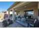 Outdoor patio with seating and dining areas at 24454 N 173Rd Ln, Surprise, AZ 85387