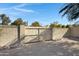 Backyard with a wooden gate at 2543 E Manhatton Dr, Tempe, AZ 85282