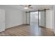 Bright bedroom with wood-look floors and barn door at 2543 E Manhatton Dr, Tempe, AZ 85282