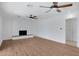 Spacious living area with wood floors, fireplace, and ceiling fans at 2543 E Manhatton Dr, Tempe, AZ 85282